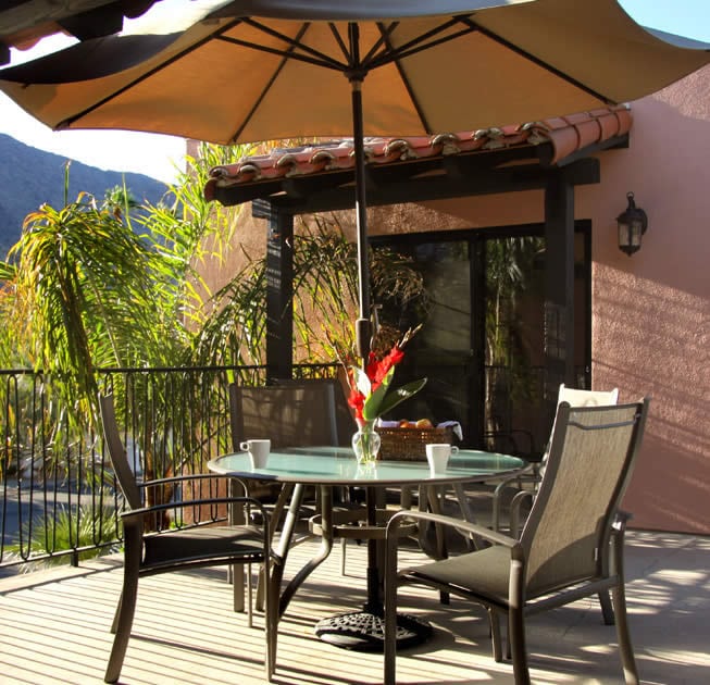The Townhouse patio table with umbrella and chairs